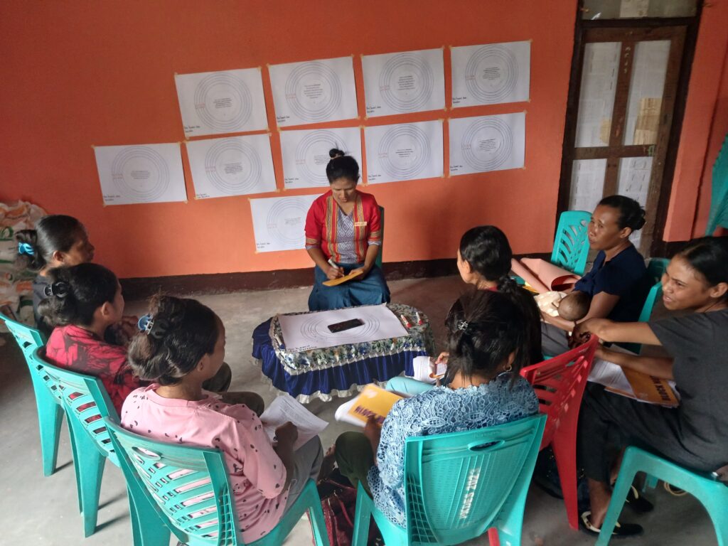 Woman speaking to a group of other women