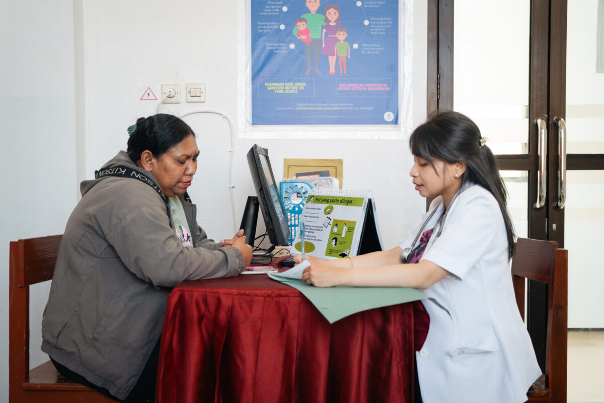 A woman talking to a doctor