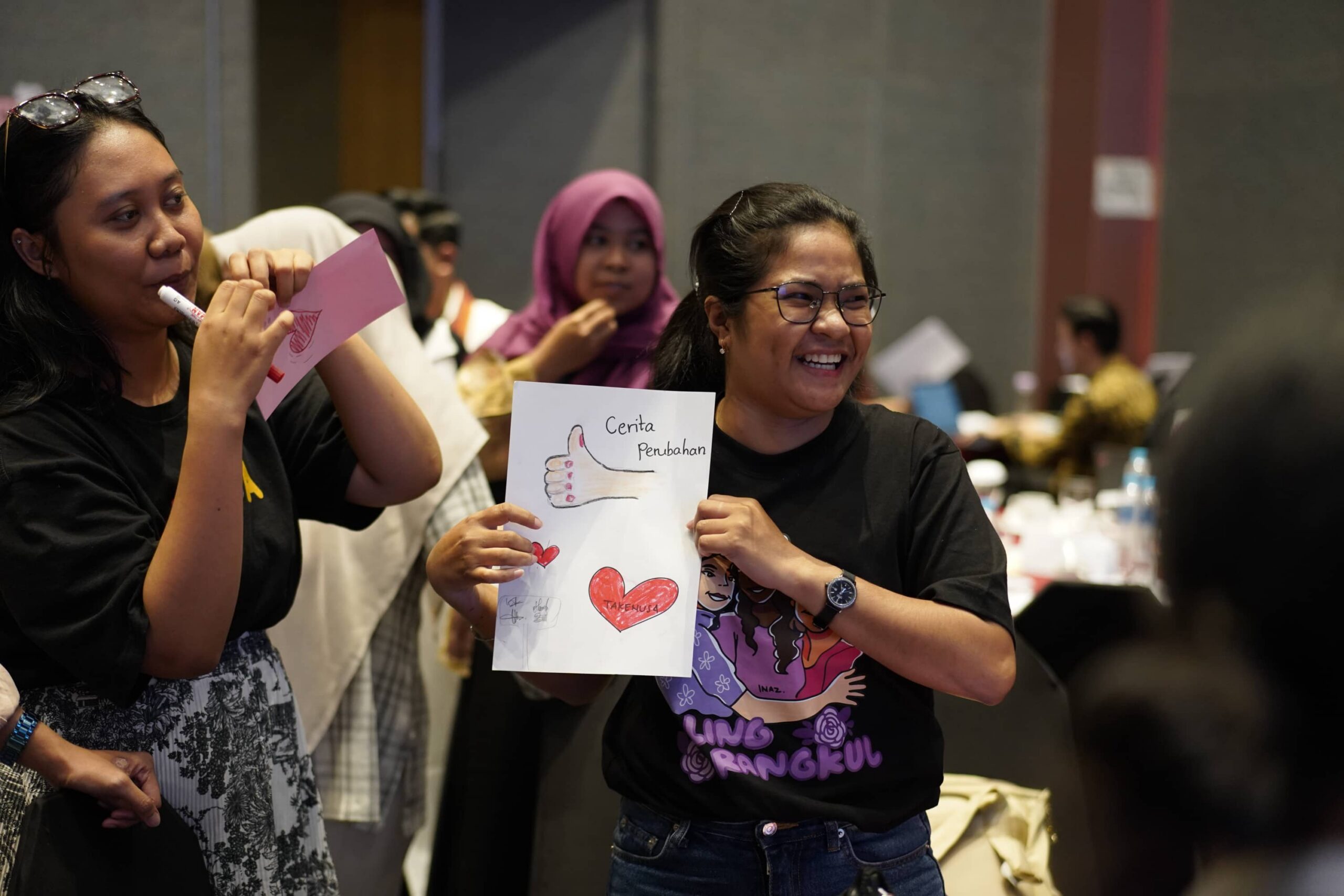 Women holding handmade posters