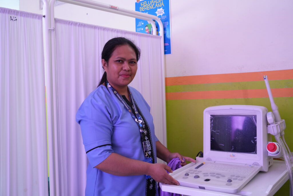 Woman with ultrasound machine