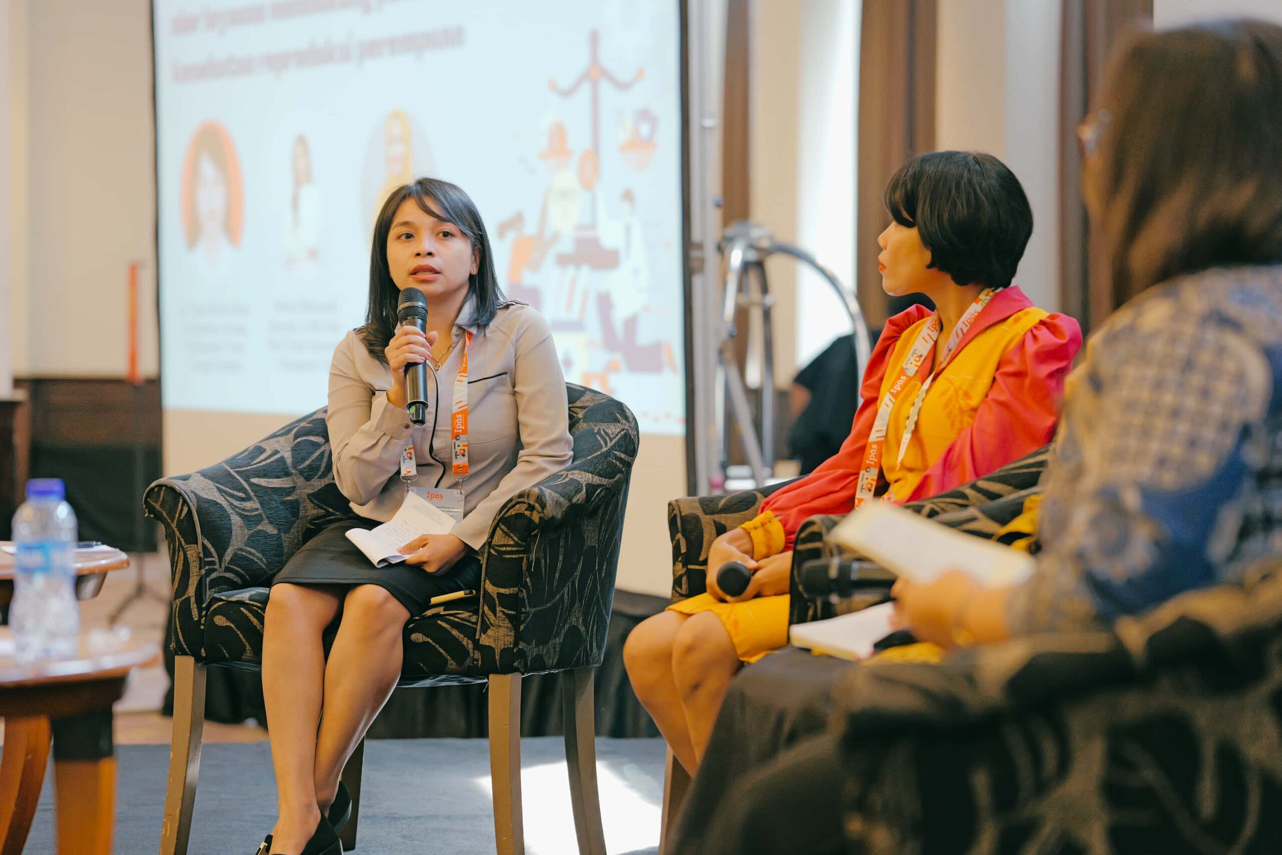 Women speaking into a microphone