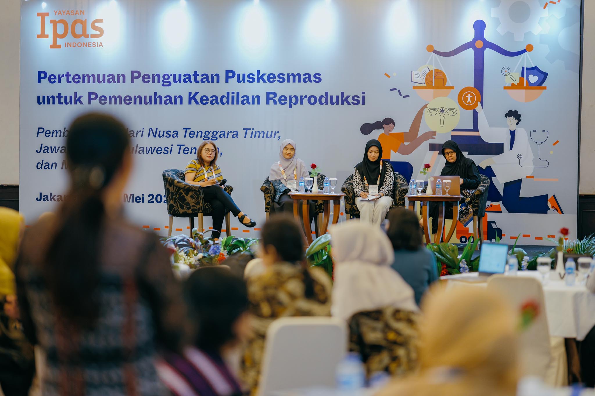Panel speaking to audience